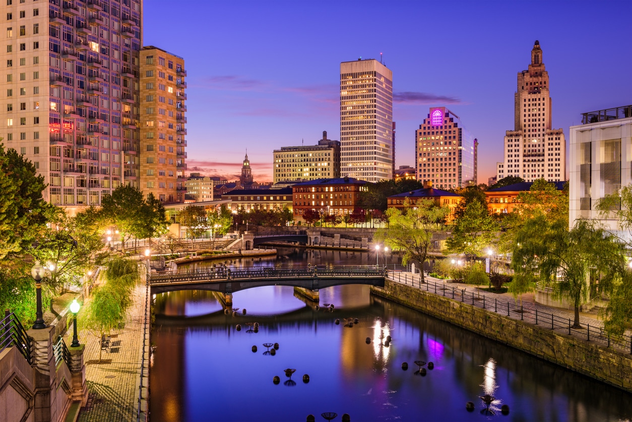 Providence, Rhode Island Cityscape Urban New England skyline at night reflected in a canal with illuminated bridges and modern buildings