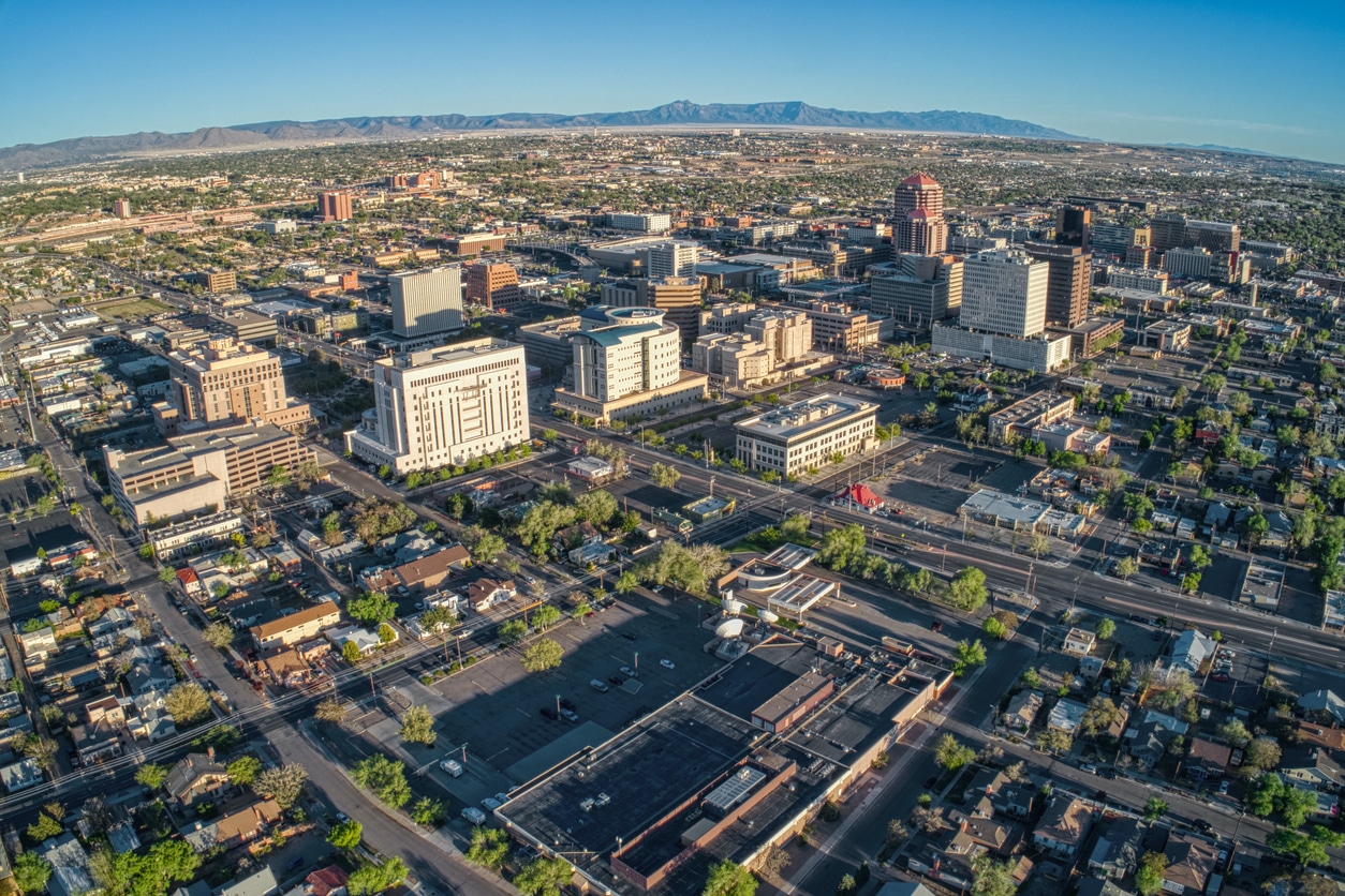 Daytime view of the Albuquerque, New Mexico, downtown skyline and residential area with mountains behind