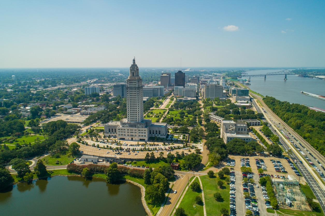 Aerial view of Louisiana State Capitol with downtown Baton Rouge, Capitol Lake, and the Mississippi River