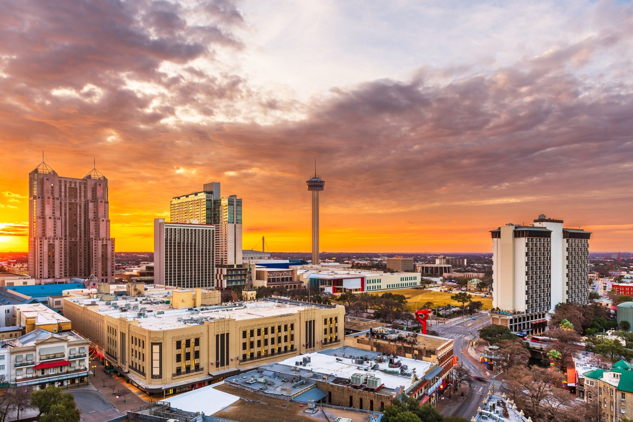 Cityscape of San Antonio, Texas, at sunset, featuring the Tower of the Americas
