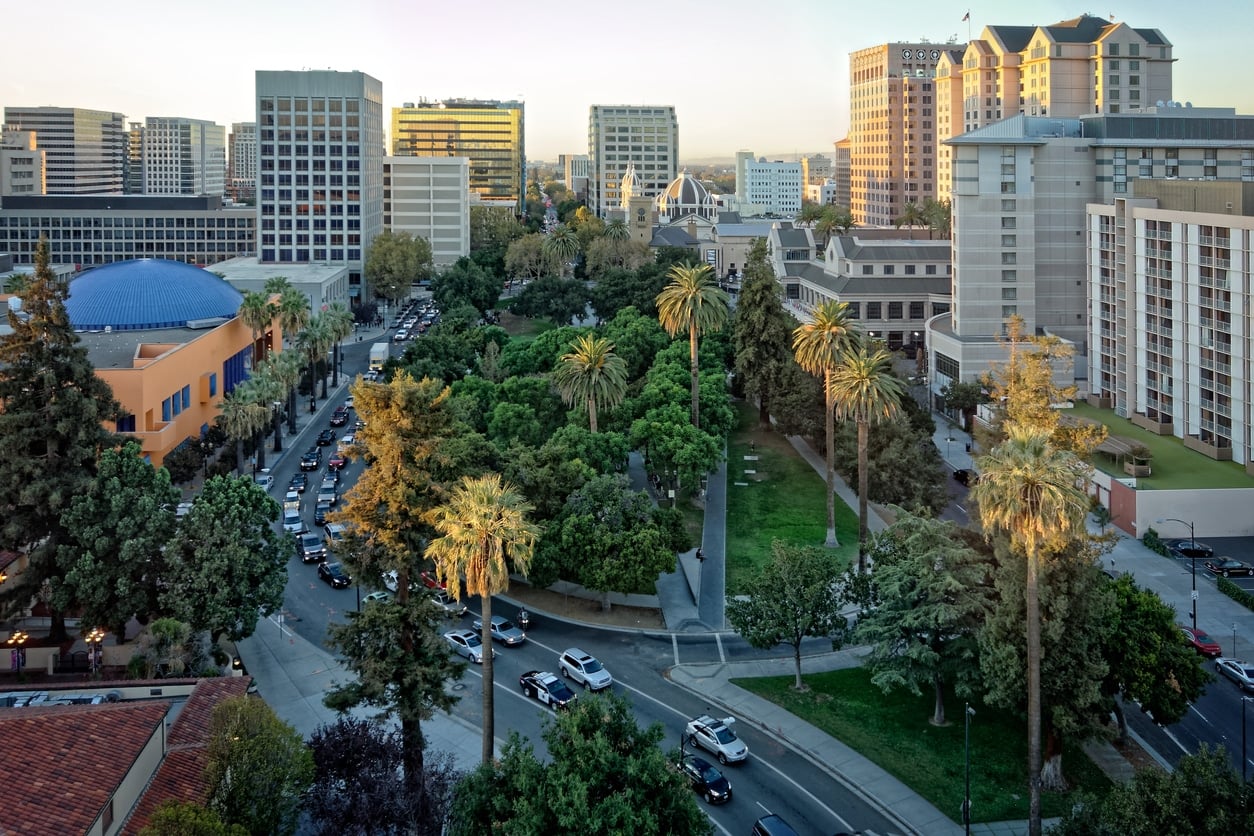 Plaza de Cesar Chavez San Jose An aerial view of downtown San Jose featuring palm trees and modern office buildings