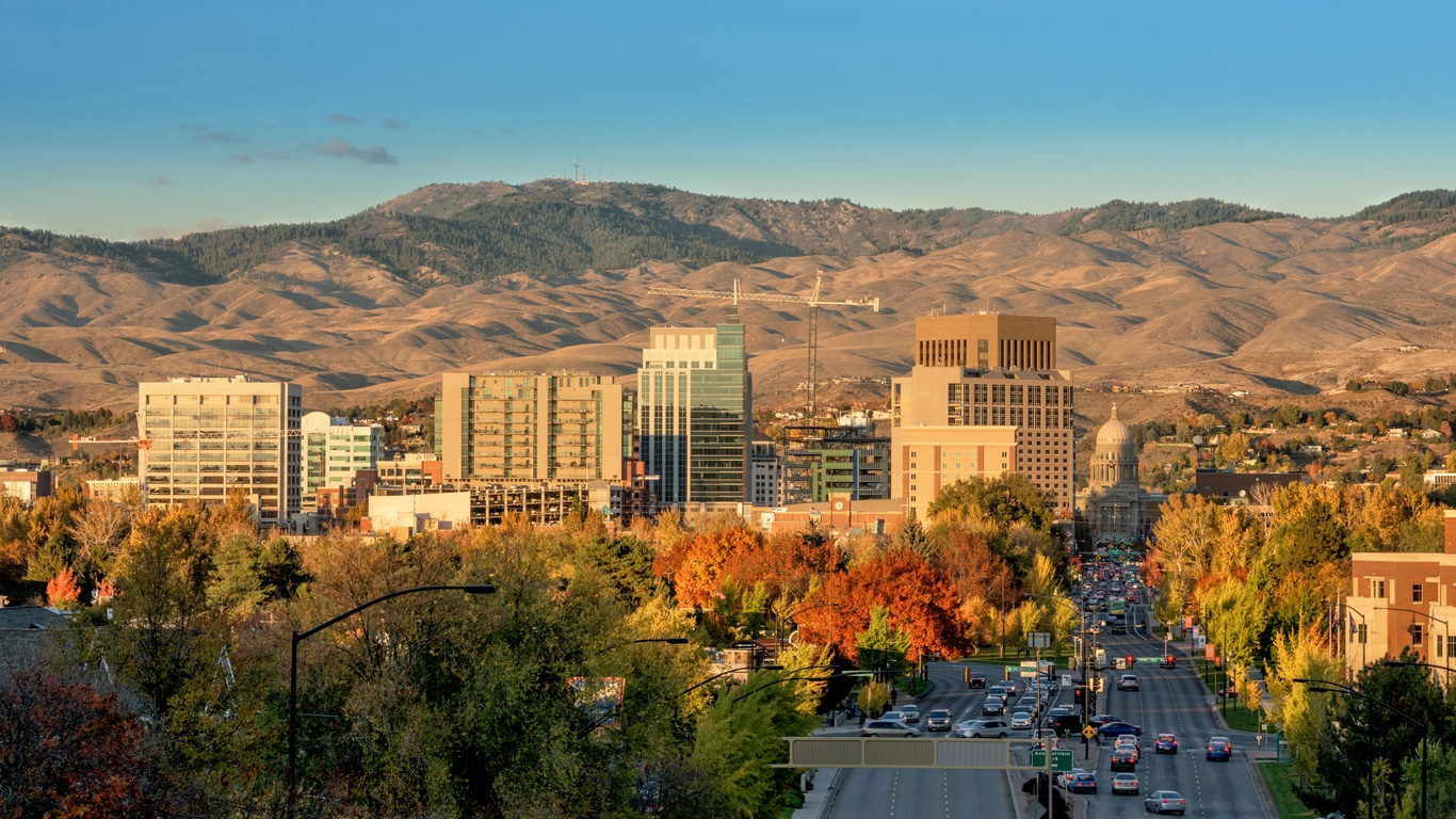 Boise, Idaho skyline in autumn, with the Idaho State Capitol building visible and rolling hills in the background