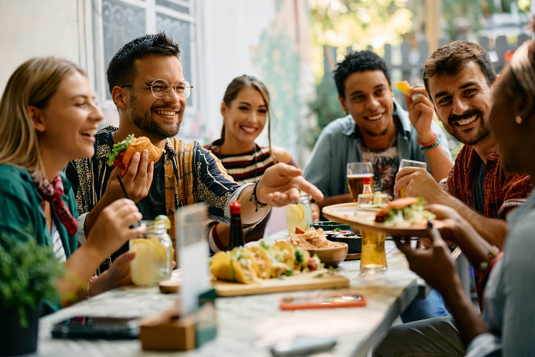 A group of people enjoying the foodie paradise that is Raleigh, NC, a highlight for those living in Raleigh