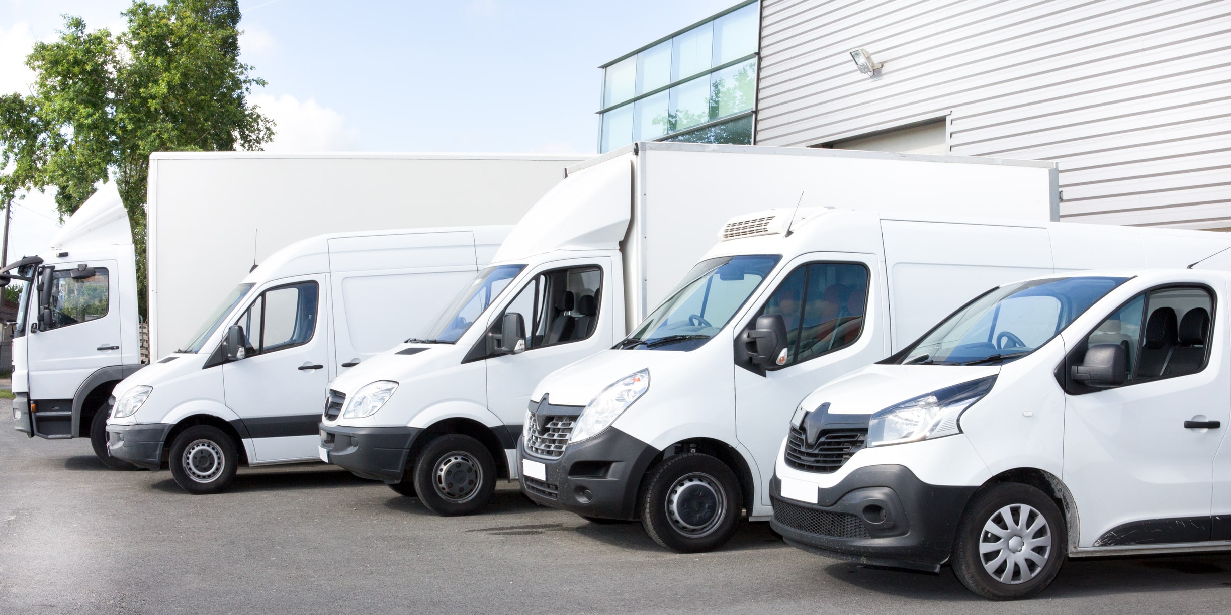  A row of white moving vans, the best way to move a pool table