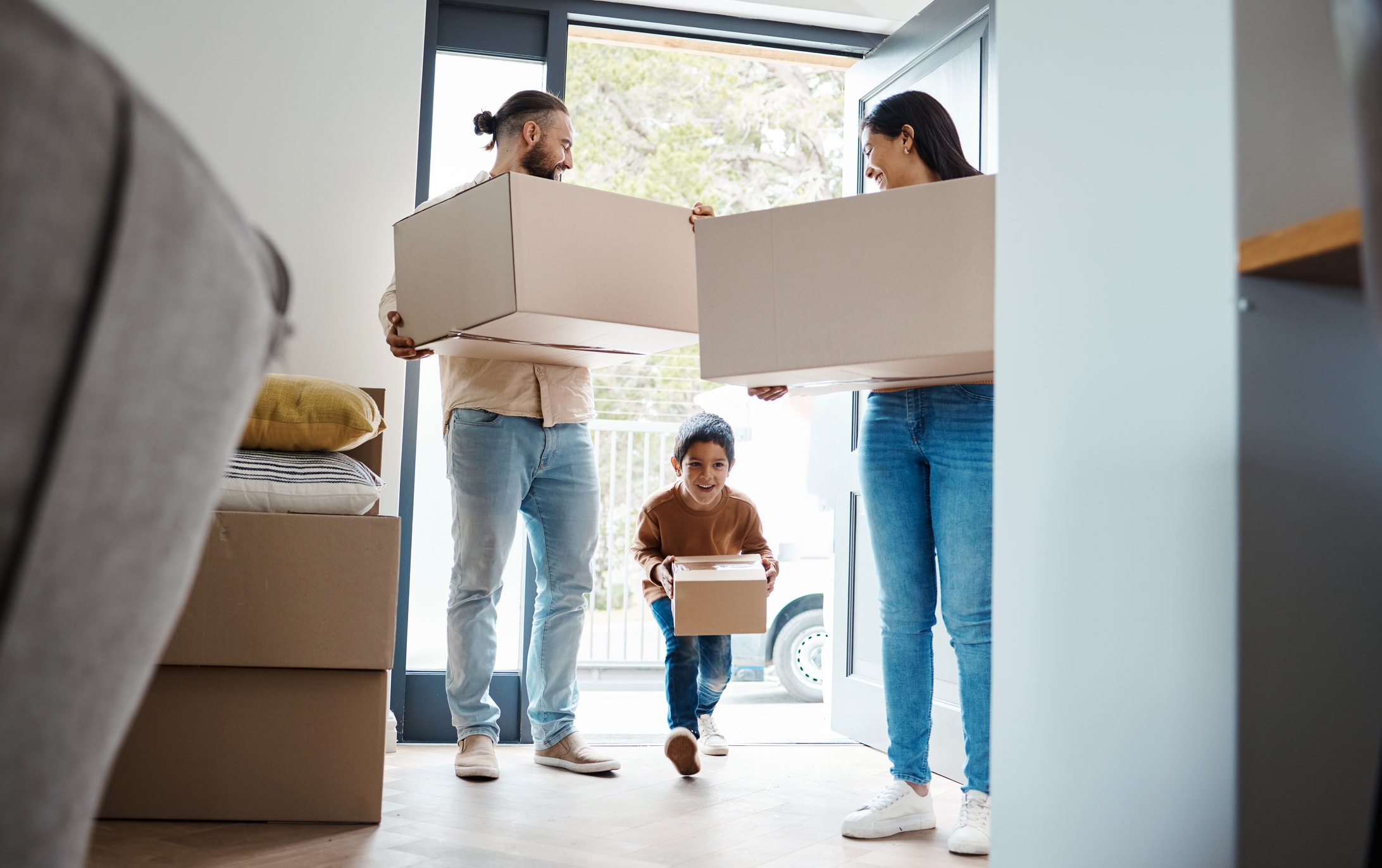 A family of three happily moves into their new home after moving from California to Texas