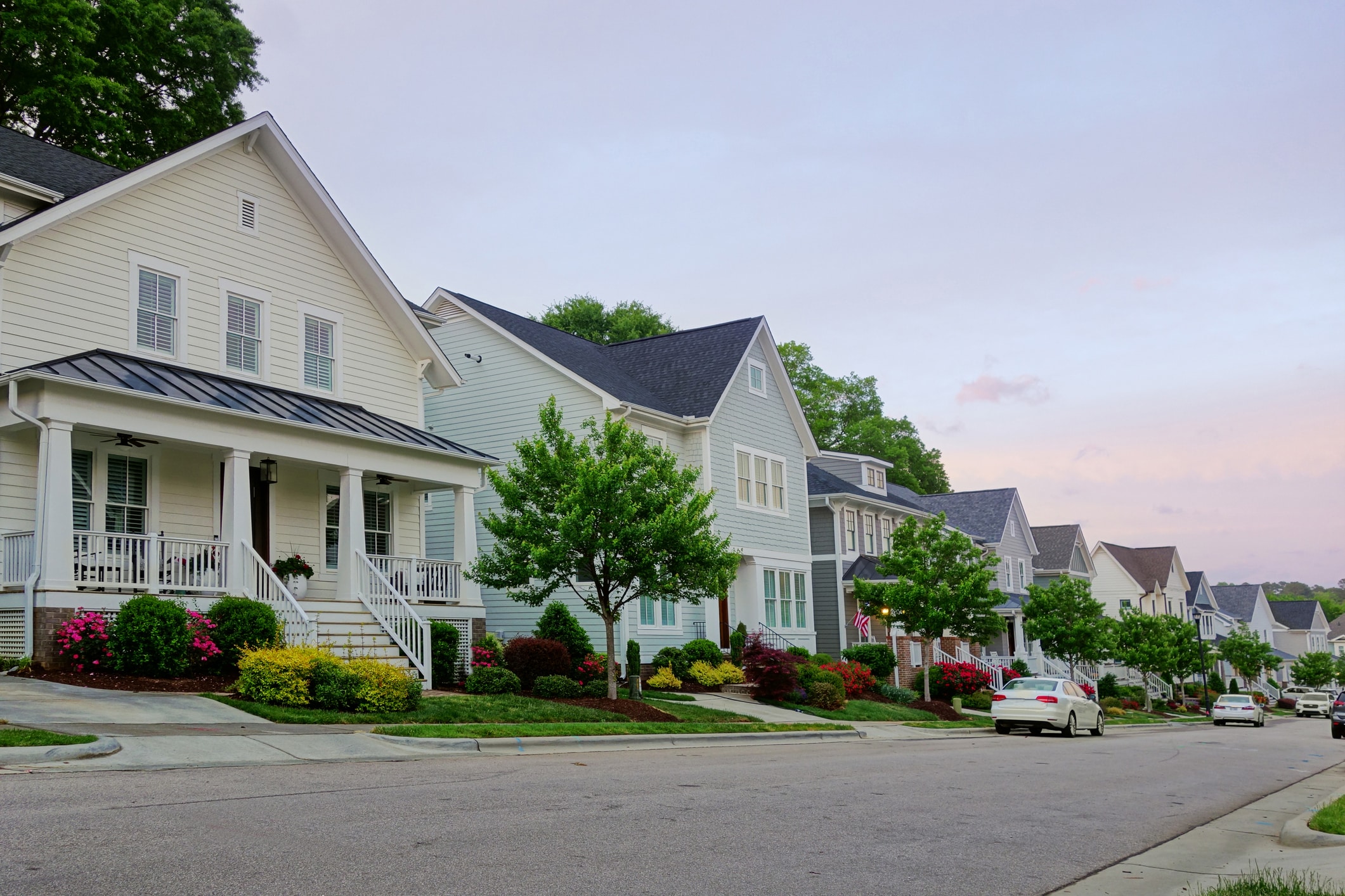 A picturesque row of homes in a charming suburban community, ideal for families considering moving to Raleigh