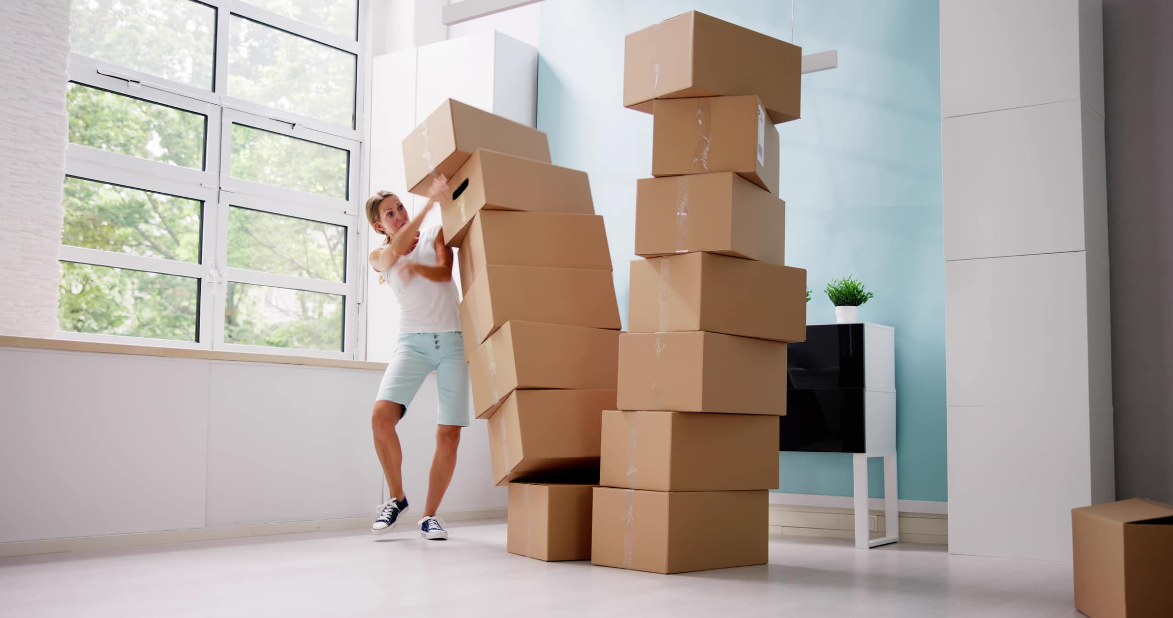 Boxes toppling onto a woman moving to Colorado