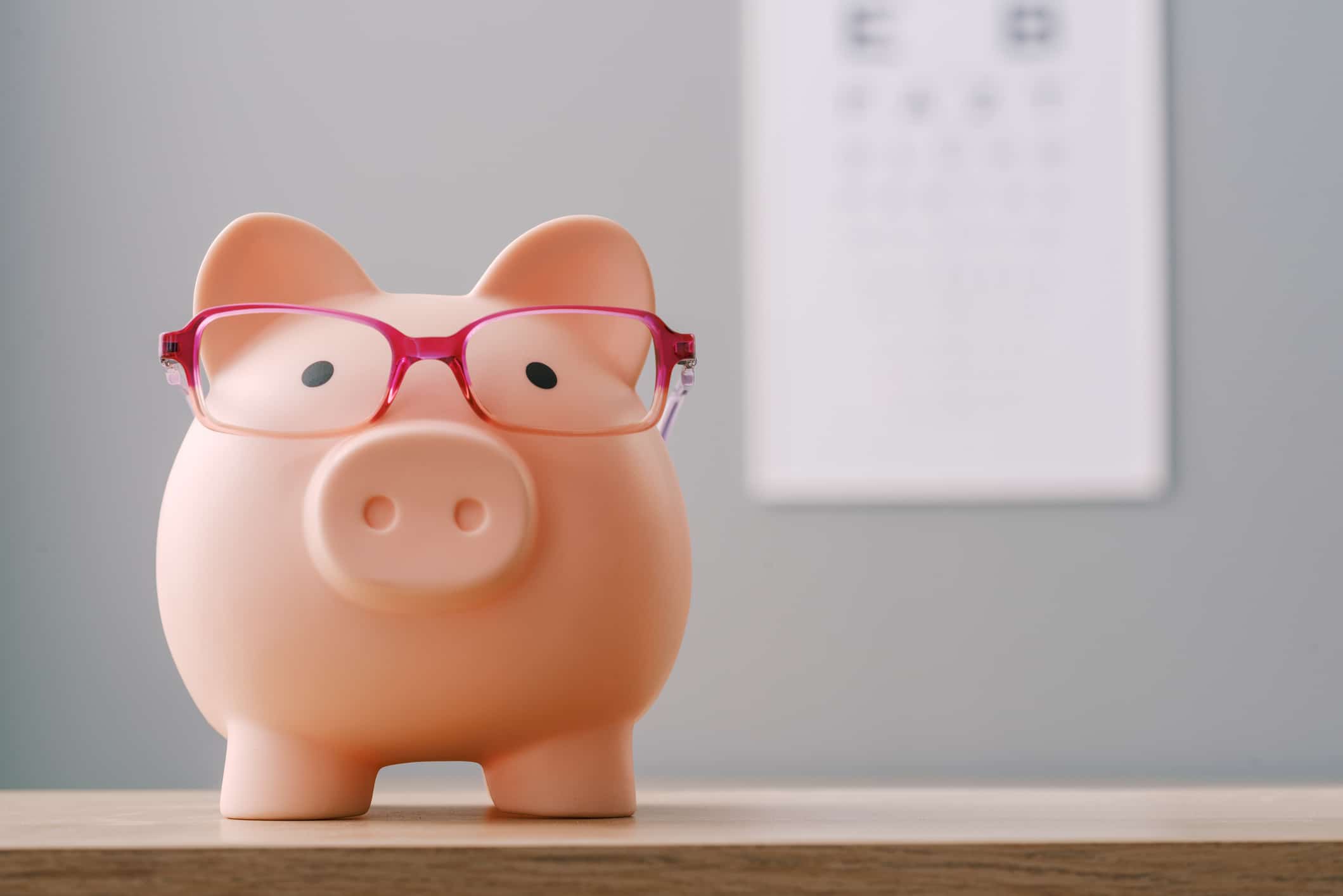 A pink piggy bank symbolizing affordability, a key factor for many considering moving to Houston