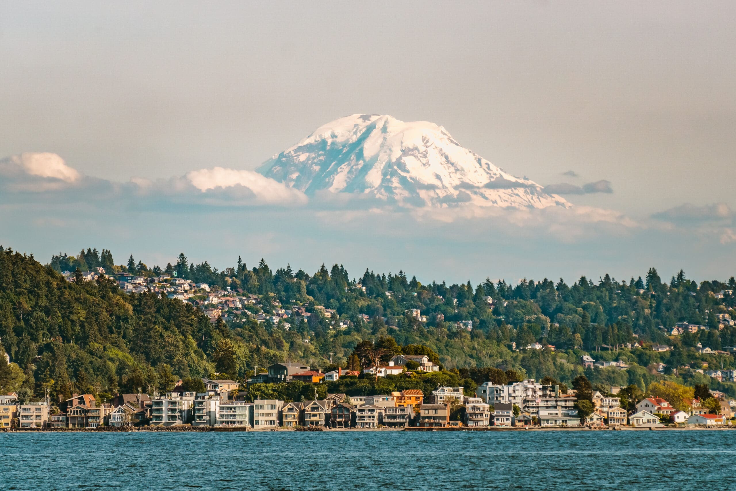 Mount Rainier emerging from the clouds above Puget Sound, a beautiful sight for those living in Seattle