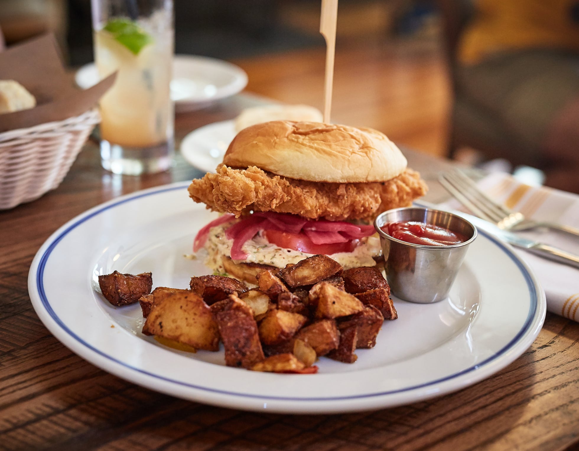 Southern fried chicken burger with potatoes and ketchup, a popular dish those moving to South Carolina should try