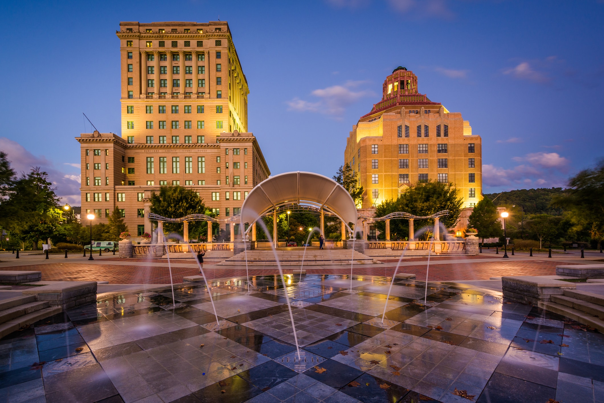 Beautifully lit Pack Square Park in Downtown Asheville, a top Asheville neighborhood for city lovers 