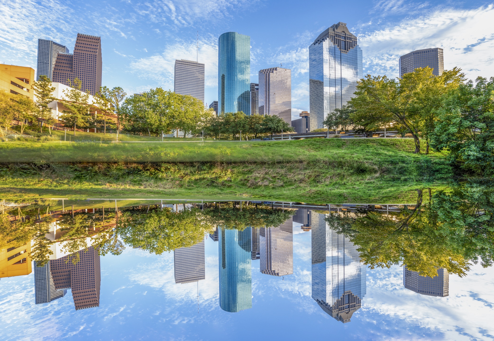 Houston skyline viewed from Buffalo Bayou Park, a stunning scene that attracts many people moving to Houston