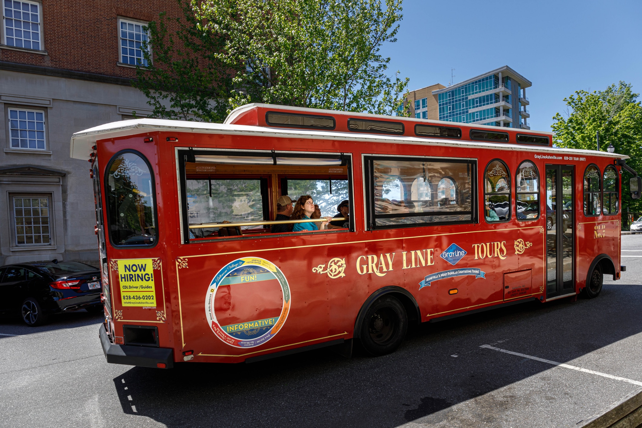 A Gray Line Tour Bus in Montford, a charming and richly historic neighborhood ideal for those moving to Asheville