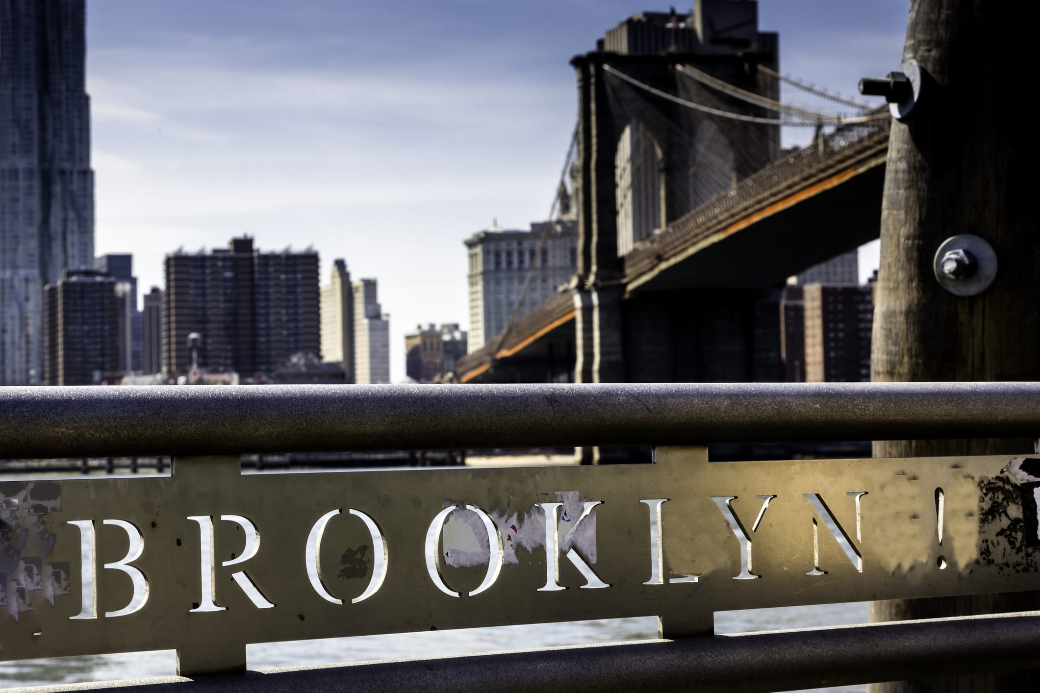 Brooklyn sign with the iconic Brooklyn Bridge in the background, evoking the journey and excitement of a move to Brooklyn