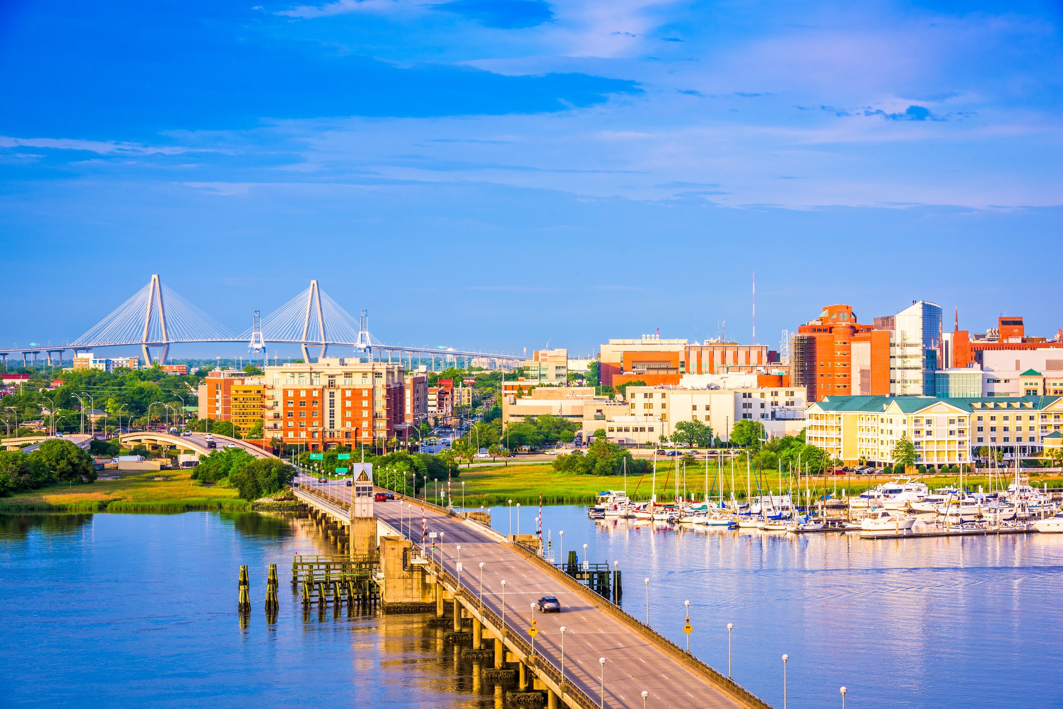 The scenic Charleston waterfront with the Ravenel Bridge, a charming destination for those moving to South Carolina