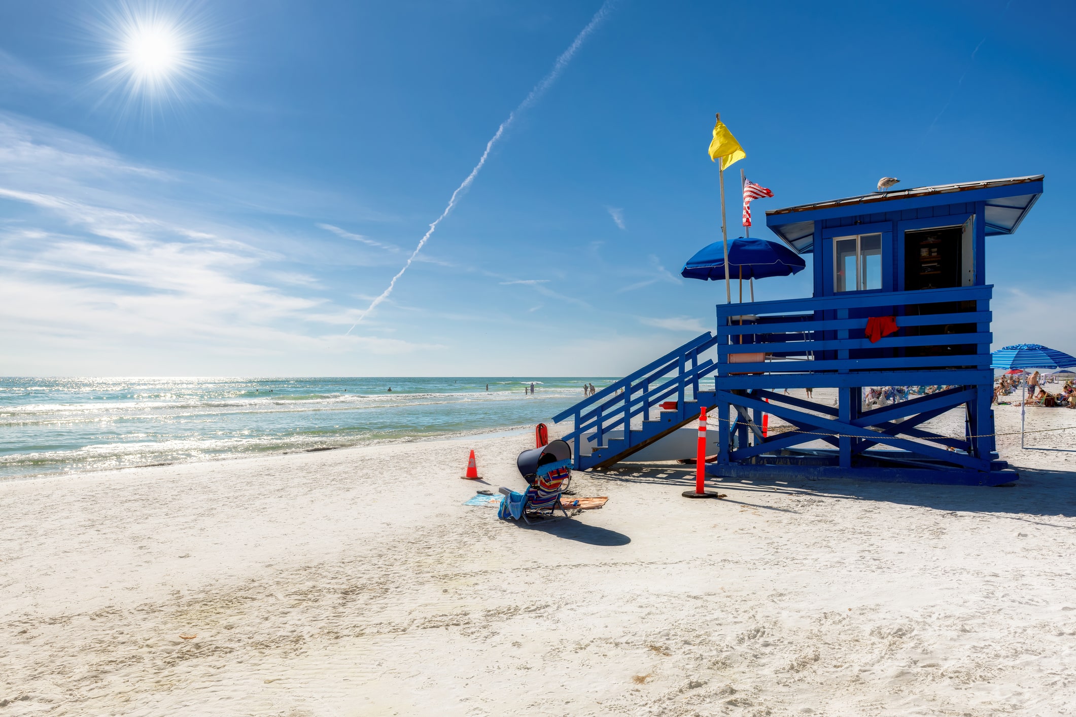 A blue lifeguard hut on Sarasota's white sand beach—a must-visit gem for anyone moving to Florida.