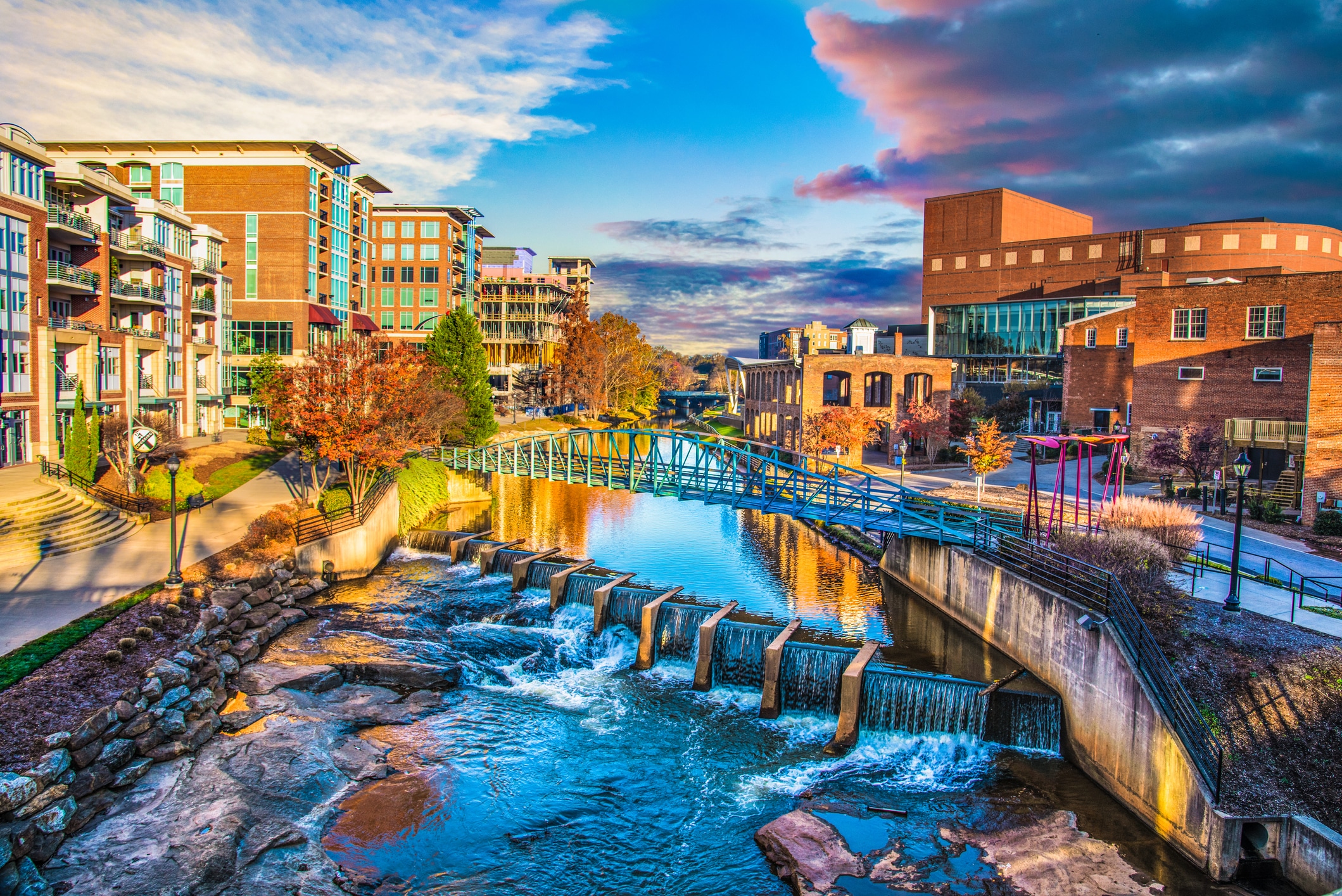 Scenic view of Falls Park on the Reedy in Downtown Greenville, featuring cascading waterfalls and bridges