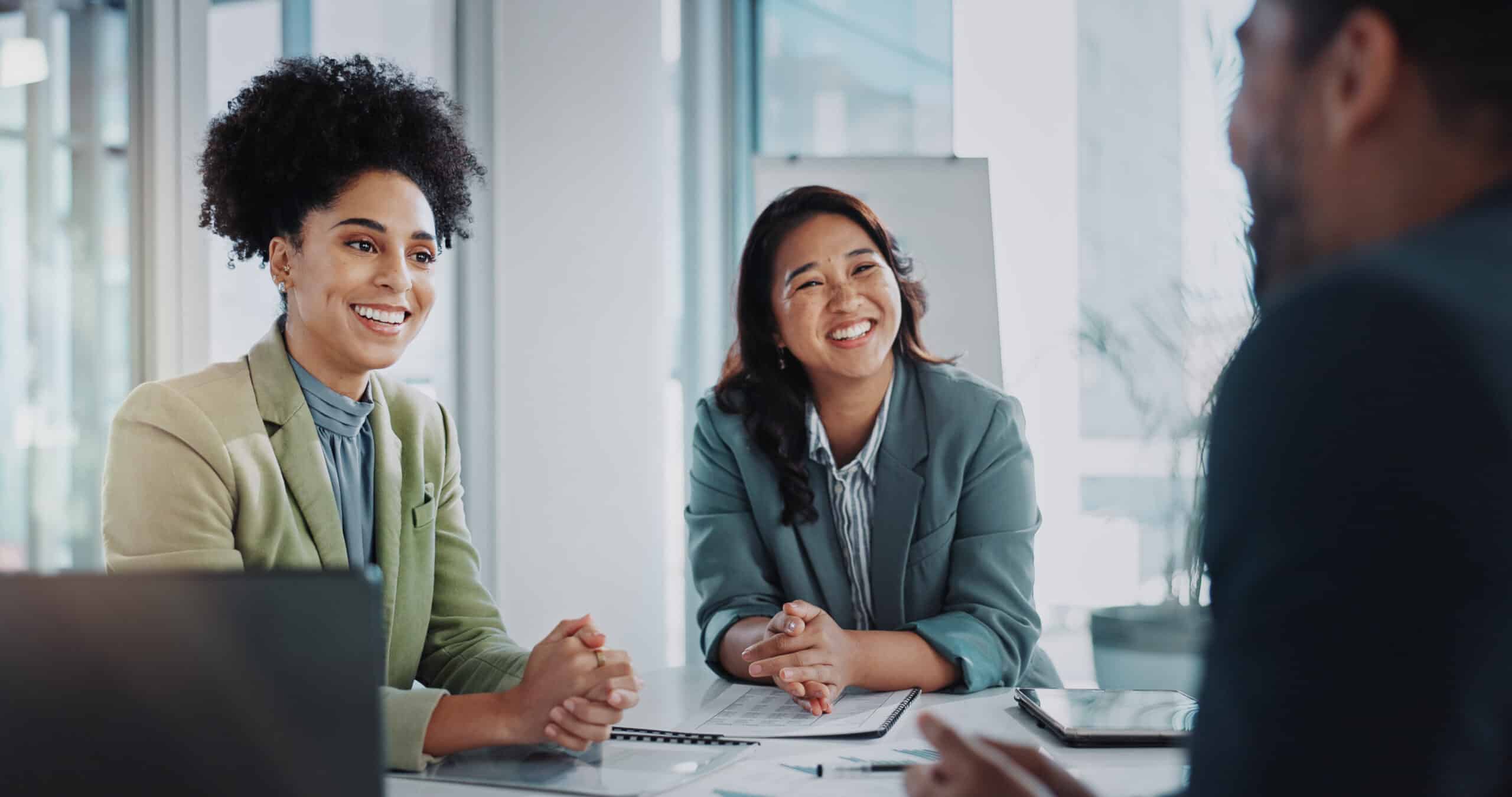 A man in a job interview with two women, reflecting Jacksonville's thriving job market