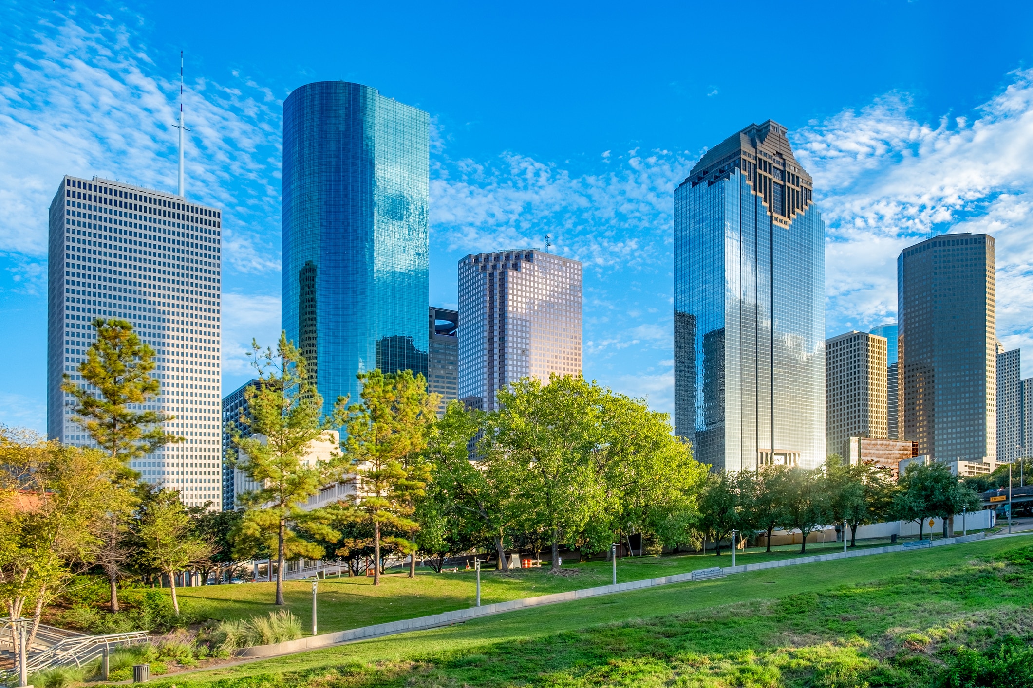 Luscious green park featuring the downtown Houston’s cityscape behind it