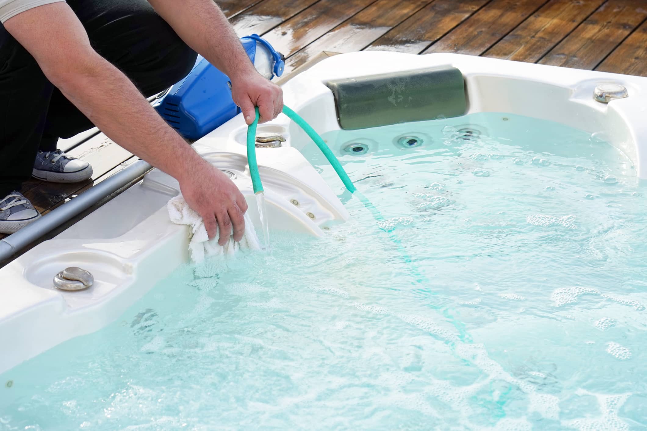 A mover setting a hot tub back up after moving it