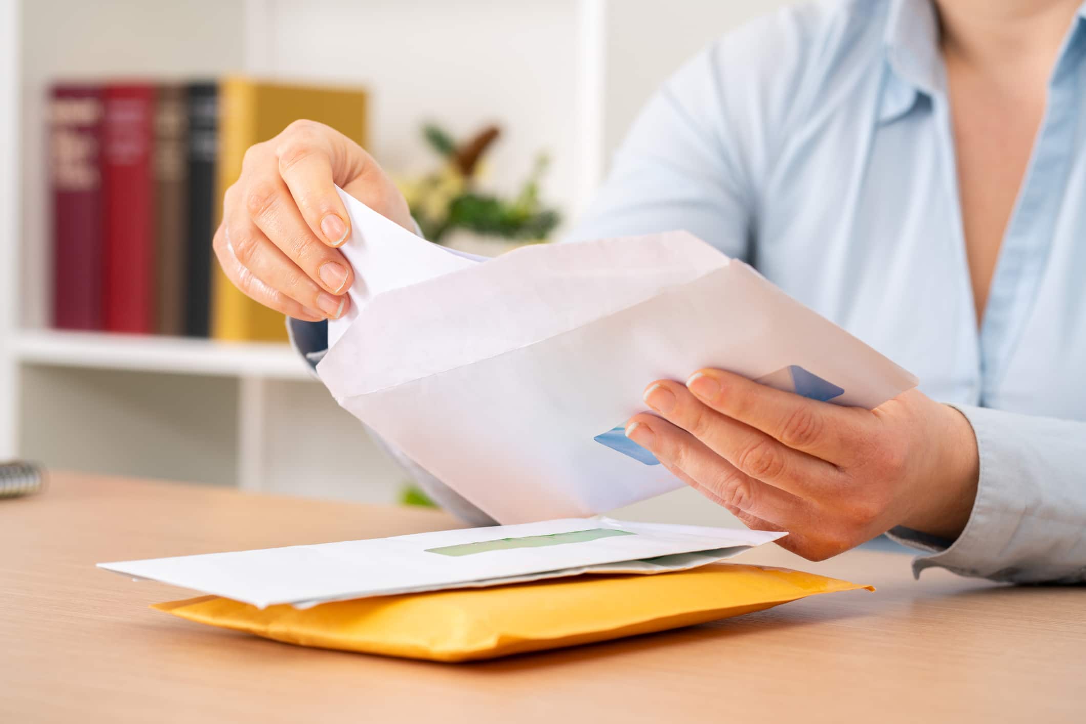 A woman sifting through her mail