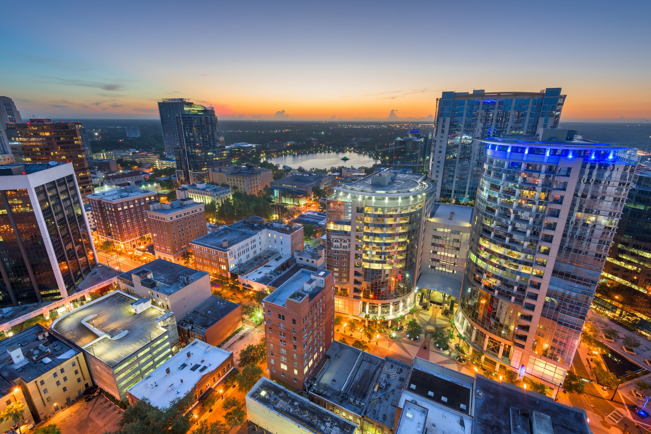 Aerial shot of a vibrant Downtown Orlando after sunset