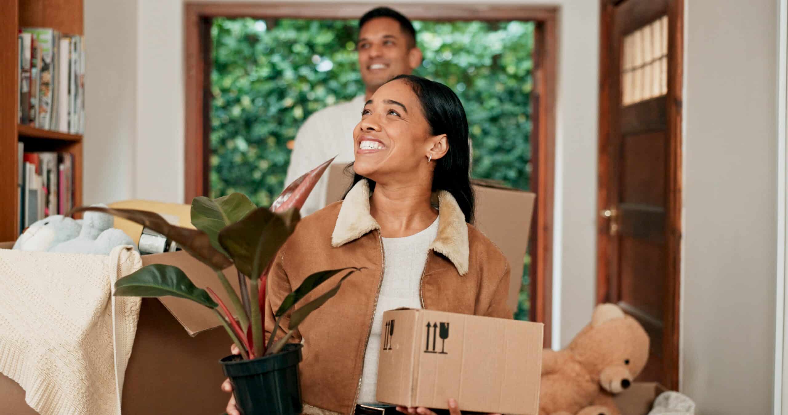 A couple happily and excitingly moving  into their new place after a long-distance move