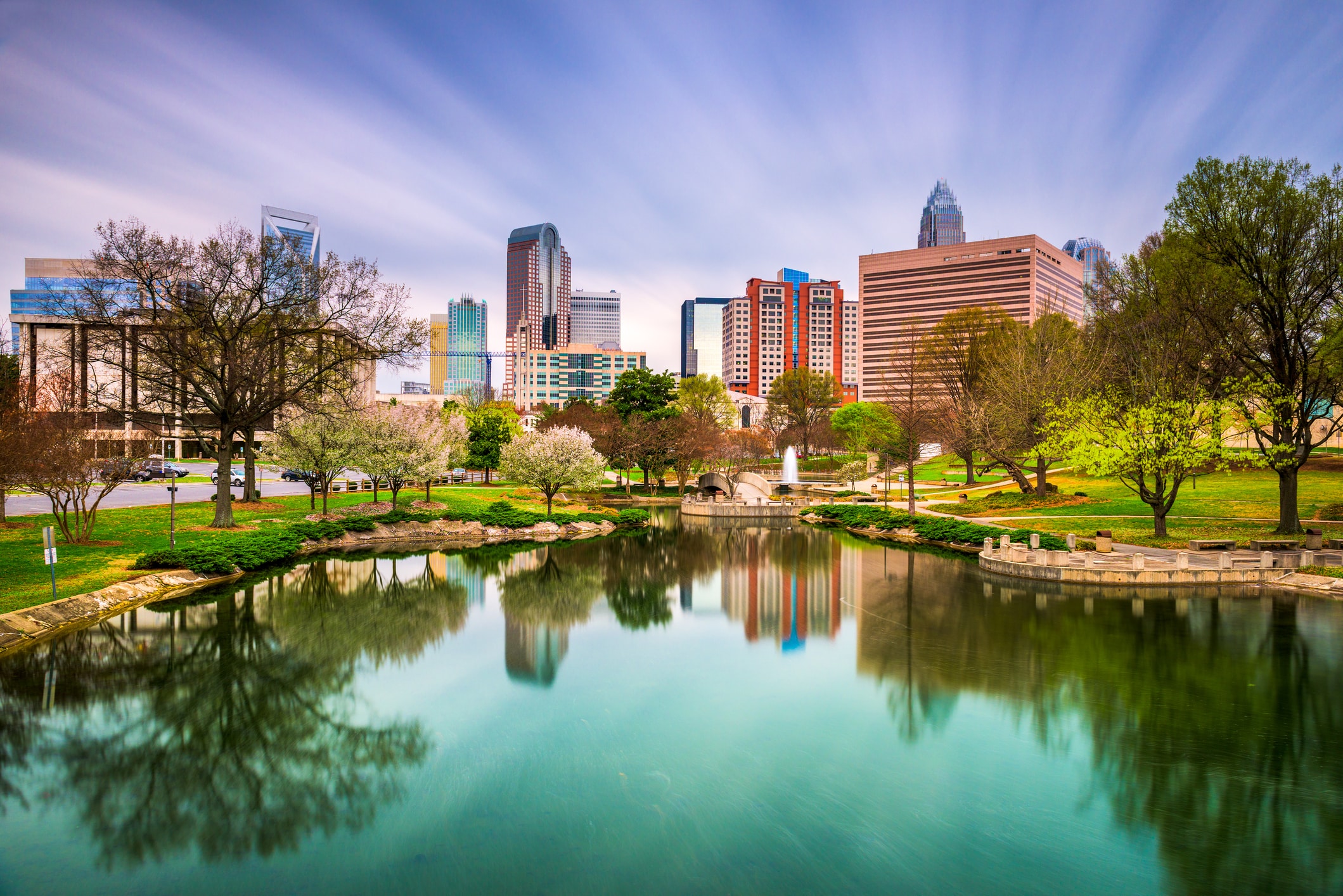 Stunning Charlotte, NC skyline from a clear lake with the Charlotte-Mecklenburg Government Center in the background