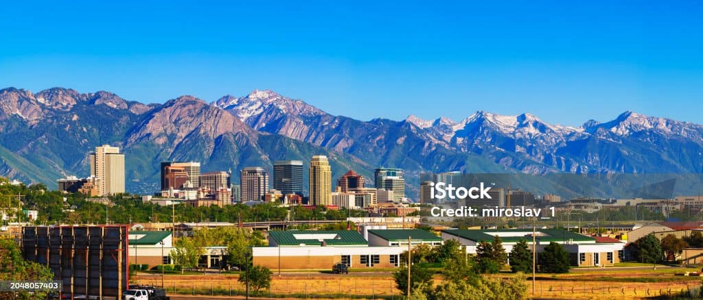 istockphoto-2048057403-1024x1024 Skyline of Salt Lake City downtown in Utah with Wasatch Range Mountains in the background.