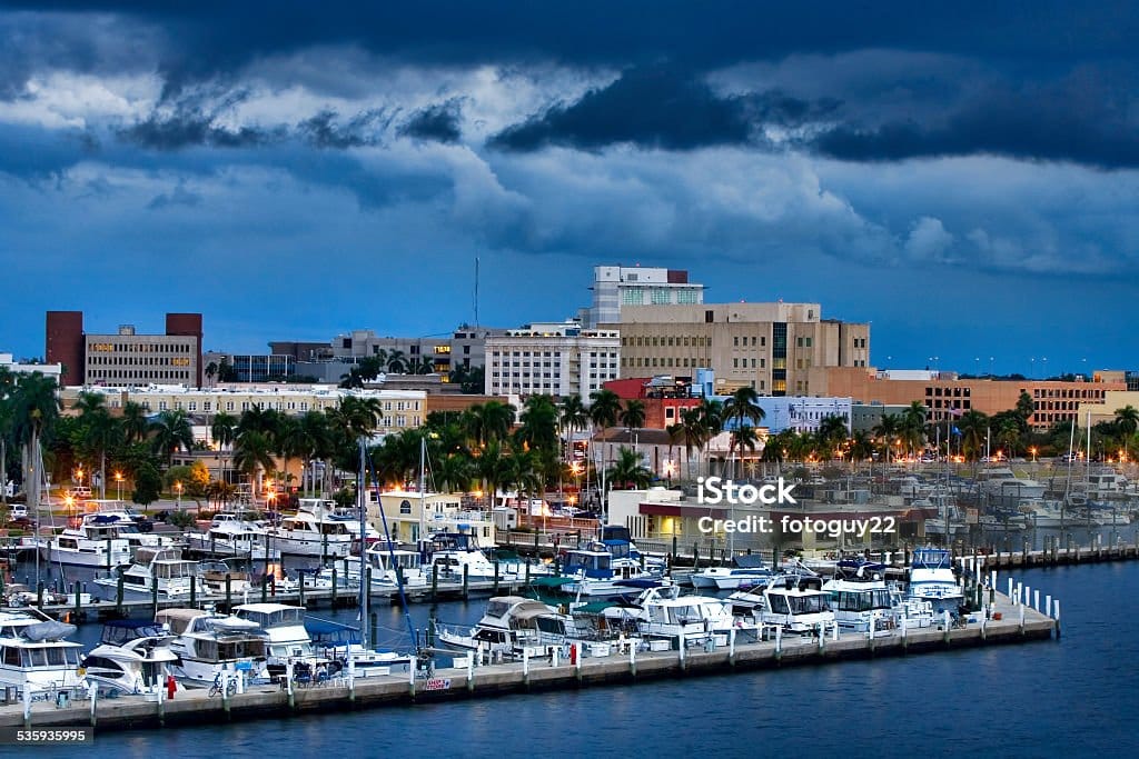 Overlooking downtown Fort Myers, Florida with the yacht basin in the foreground.  Typical summer late afternoon with storm clouds lingering.