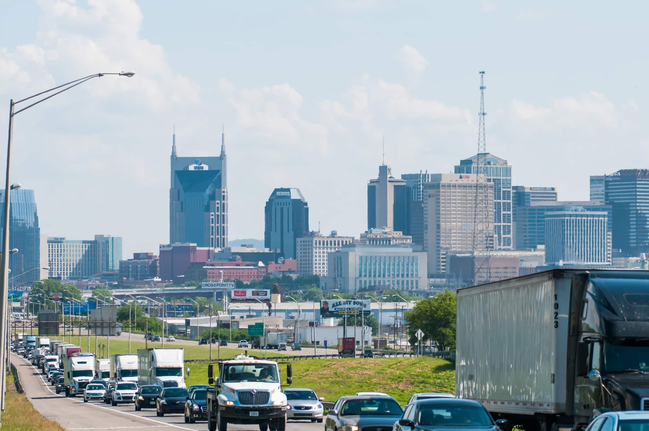 Nashville, Tennessee downtown skyline and streets Skyline of Nashville, Tennessee, viewed from the highway with the "Batman Building" in the background