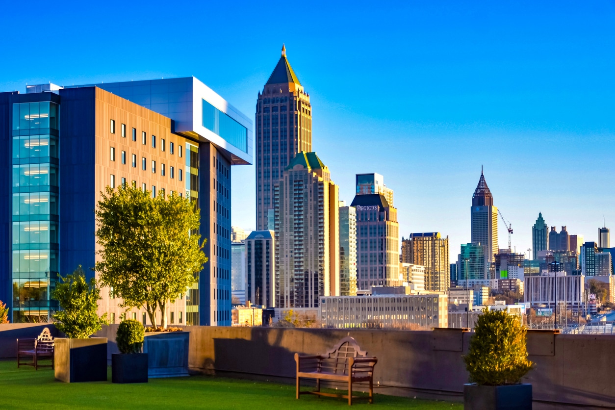 Atlanta Skyline A rooftop garden view of Midtown Atlanta, featuring a vividly colorful mix of modern skyscrapers