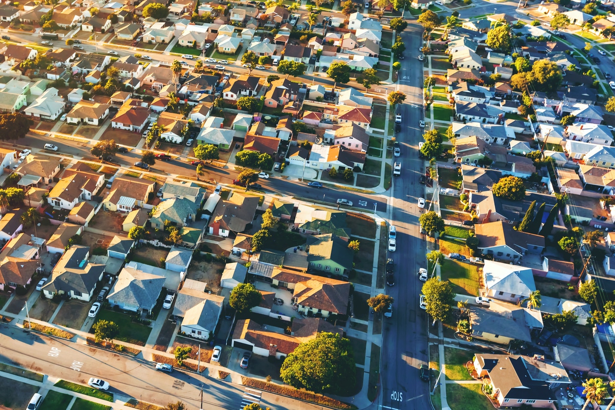 Aerial view of a Los Angeles neighborhood of Hawthorne with single-family homes and tree-lined streets