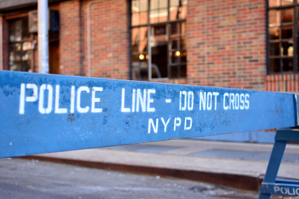 NYPD Police Line - Do Not Cross A blue NYPD barricade marked with the words “Police Line - Do Not Cross”