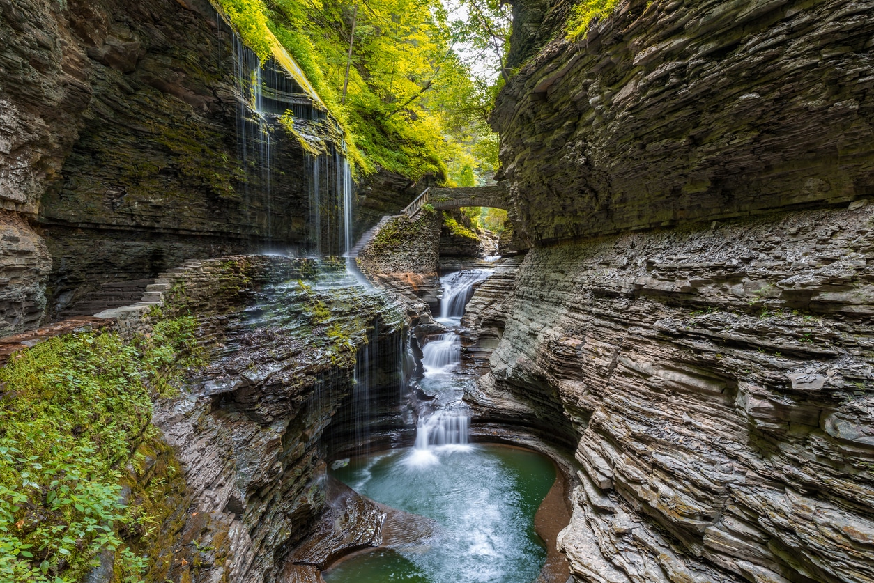 Rainbow Falls Scenic Rainbow Falls flowing through a rocky gorge in Watkins Glen State Park, New York