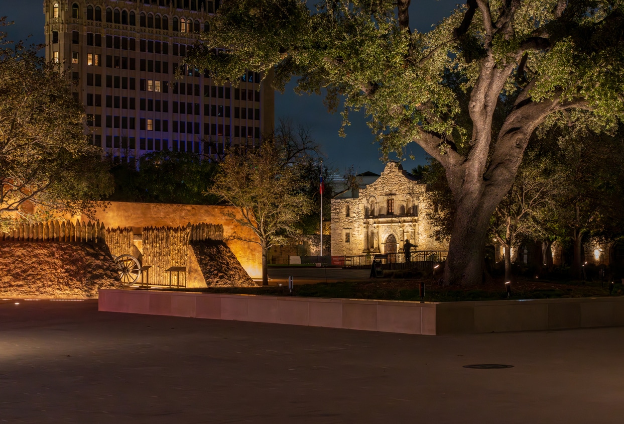 Alamo Mission, glowing with warm lights at night, a beautiful sight for those moving to San Antonio