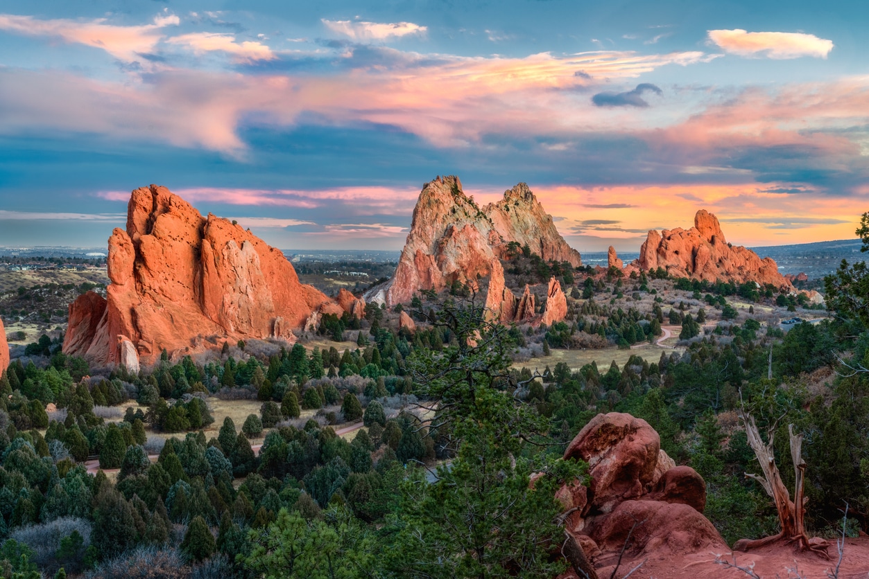 Beautiful, towering red rock formations with lush greenery in Garden of the Gods, Colorado Springs