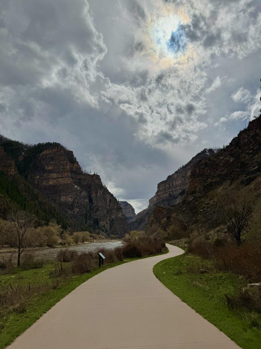 A paved path winds through Glenwood Canyon's green valley, a local treasure for those living in Colorado Springs