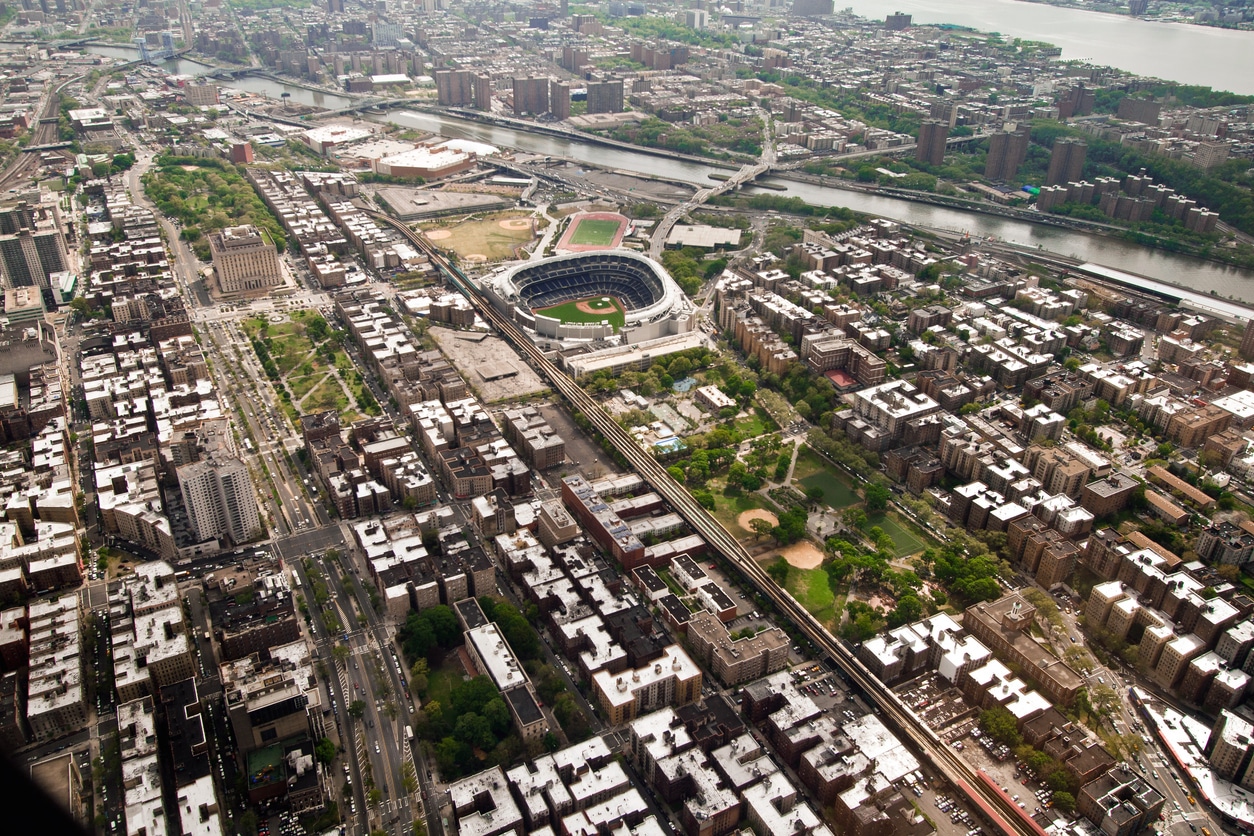 Aerial View of Manhattan and Yankees Stadium, New York, USA Aerial view of Yankee Stadium in the Bronx, NYC, with surrounding buildings and the Harlem River