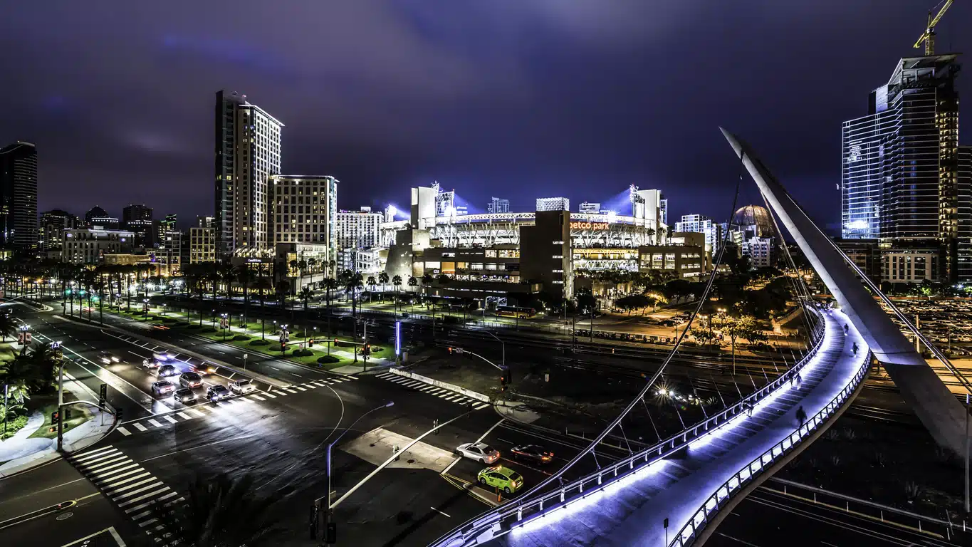 Downtown San Diego at night, with views of Harbor Drive Pedestrian Bridge, Petco Park, and glowing city lights