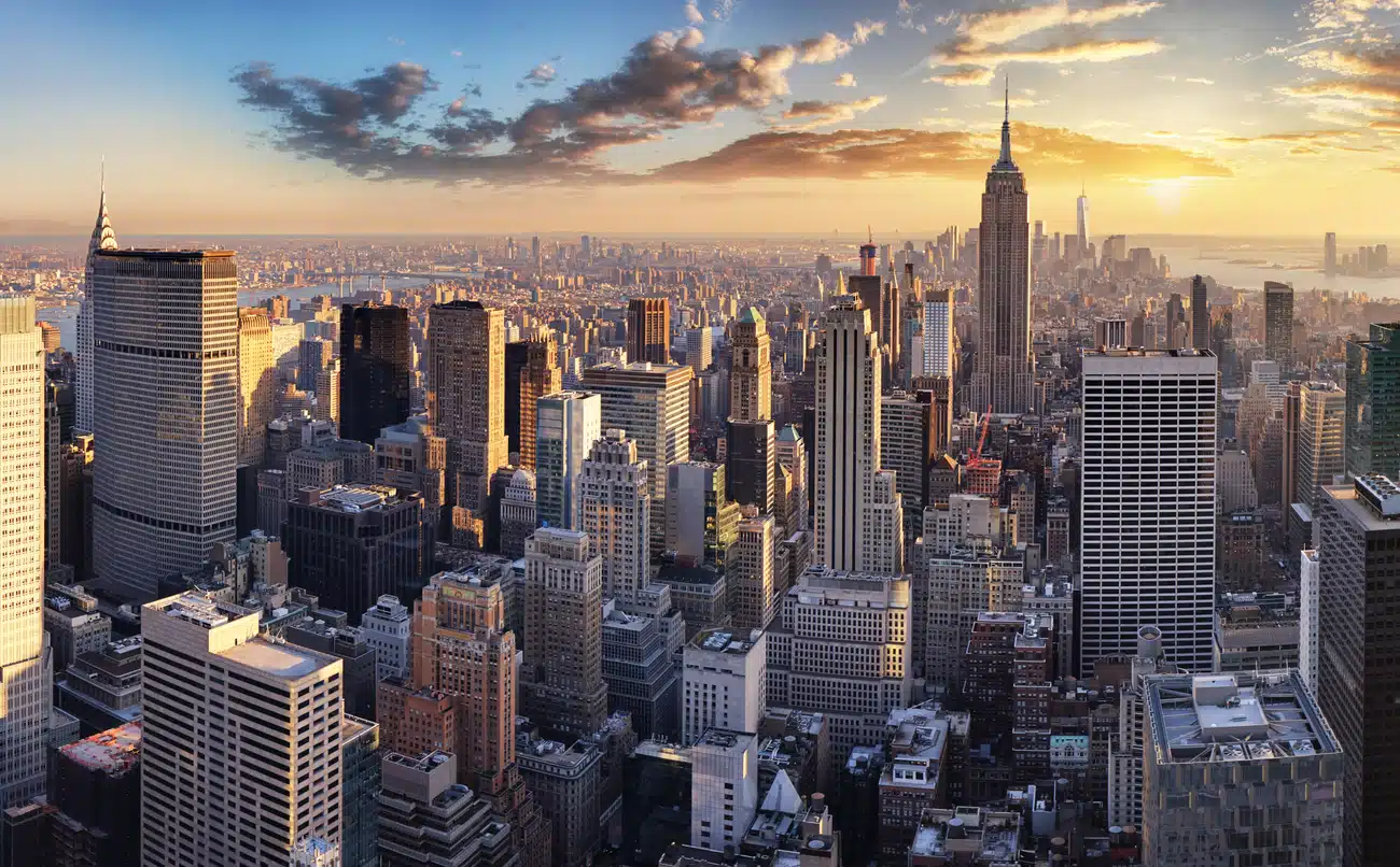New York City skyline at sunset featuring the Empire State Building, an iconic site for those living in Manhattan