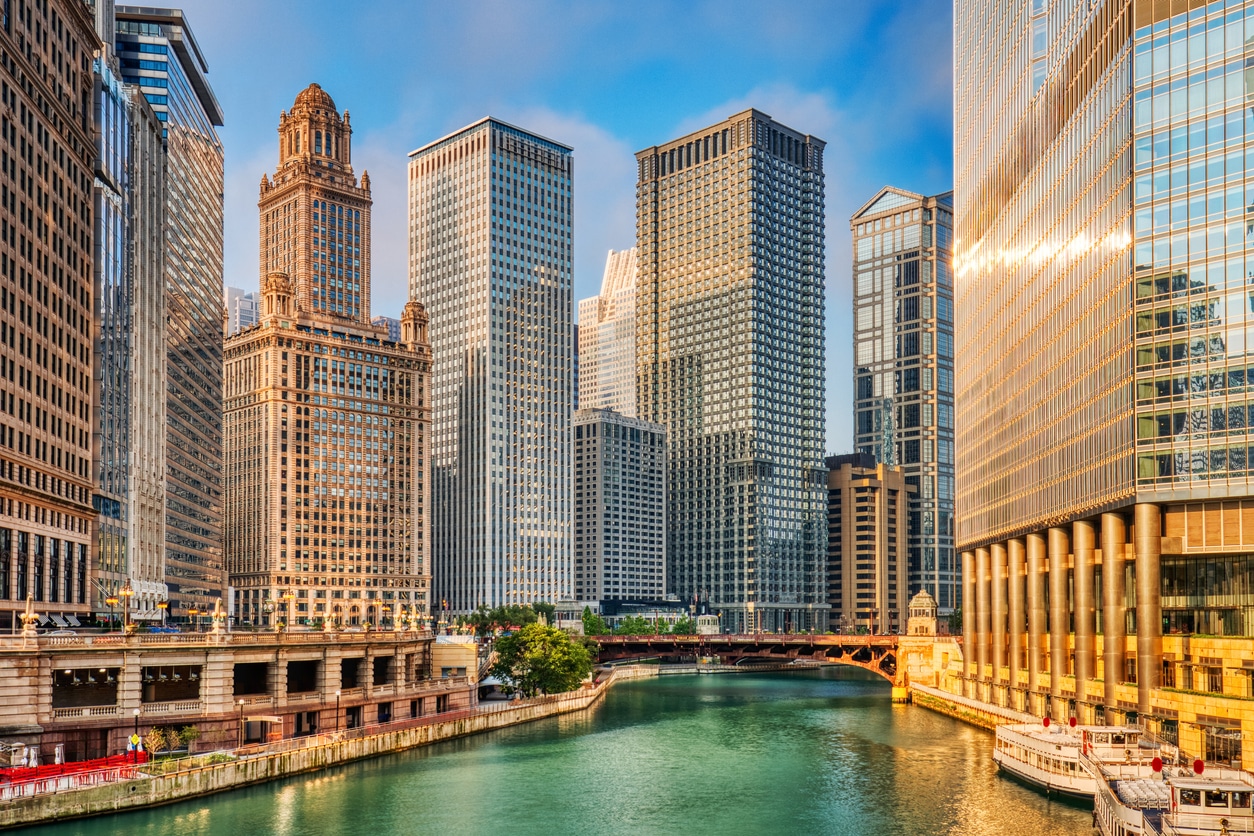 Chicago Downtown Cityscape with Chicago River at Sunrise Scenic view of the Chicago River with the Wrigley and London Guarantee Buildings along its banks