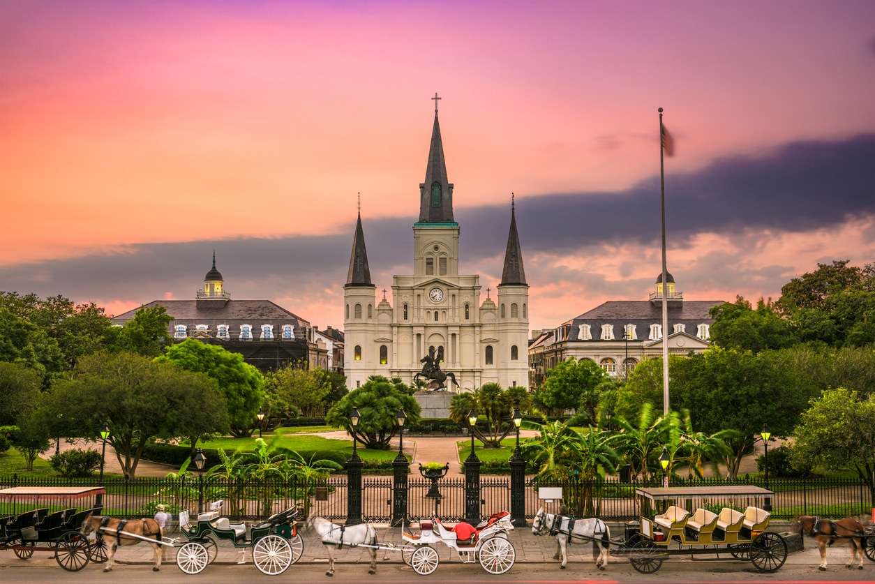 St. Louis Cathedral and Jackson Square with horse-drawn carriages, an attraction for those moving to New Orleans