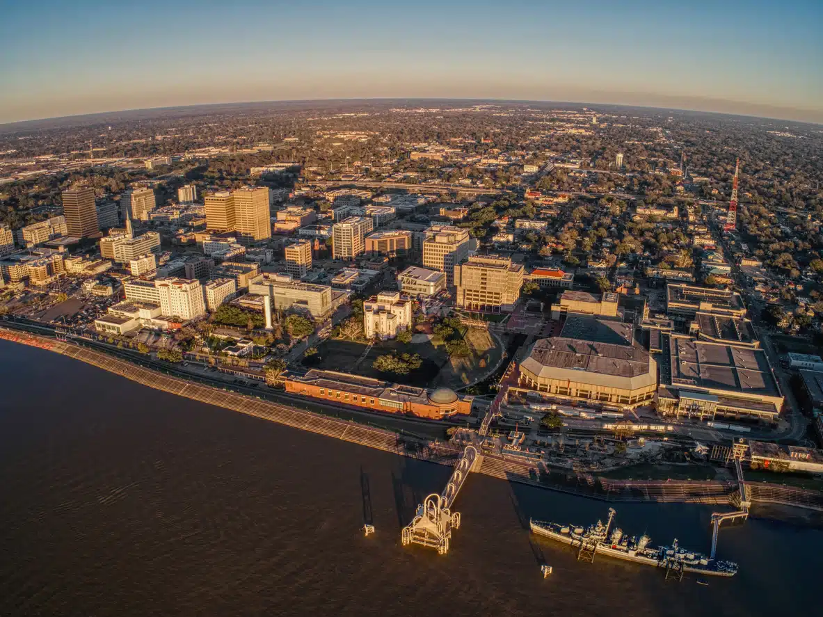 Aerial view of Louisiana State Capitol with downtown Baton Rouge, Capitol Lake, and the Mississippi River