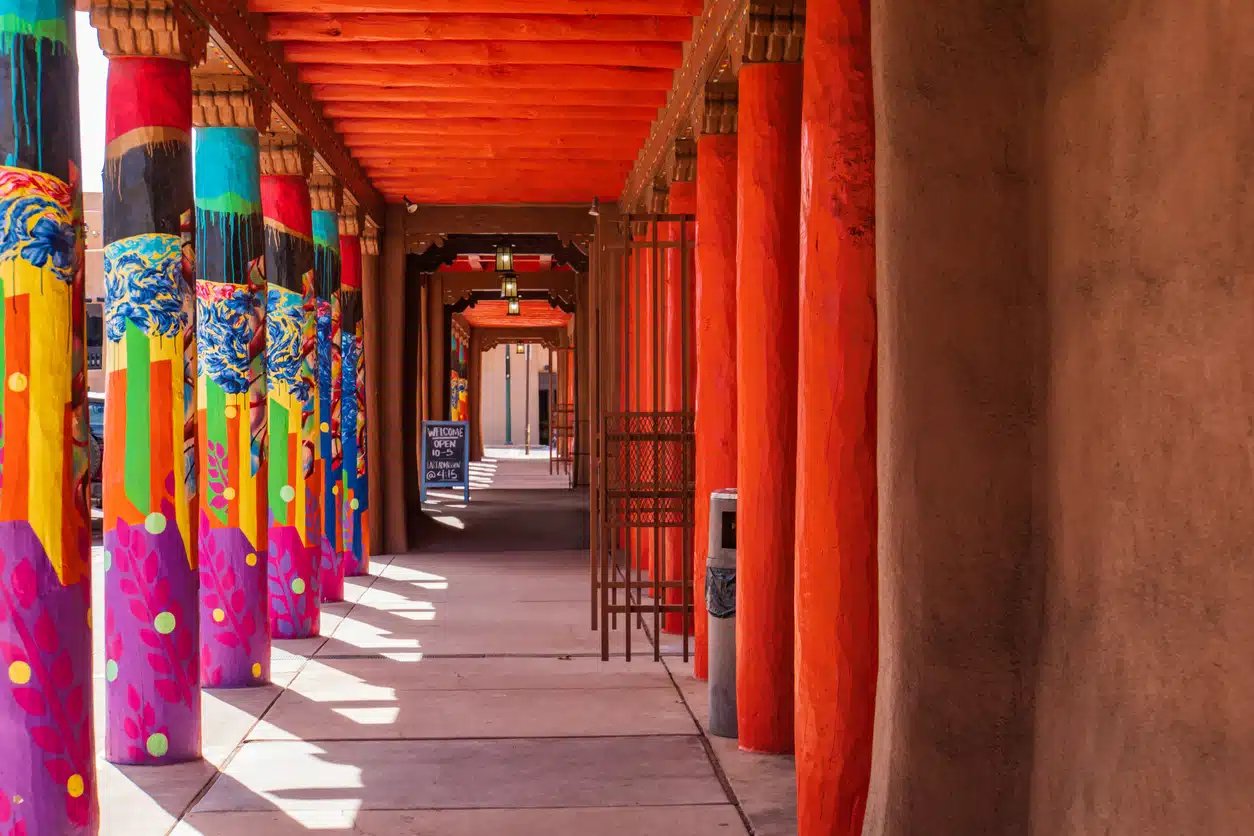 colorfully painted columns on the plaza in Santa Fe, New Mexico Vibrant painted columns line the historic Santa Fe Plaza adobe portal