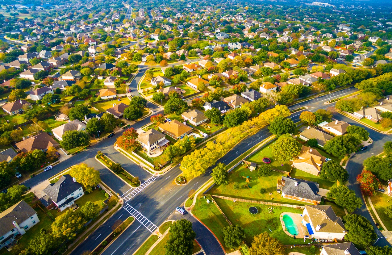 An aerial view of a suburban neighborhood in Austin, Texas, which attracts people moving from NYC to Austin