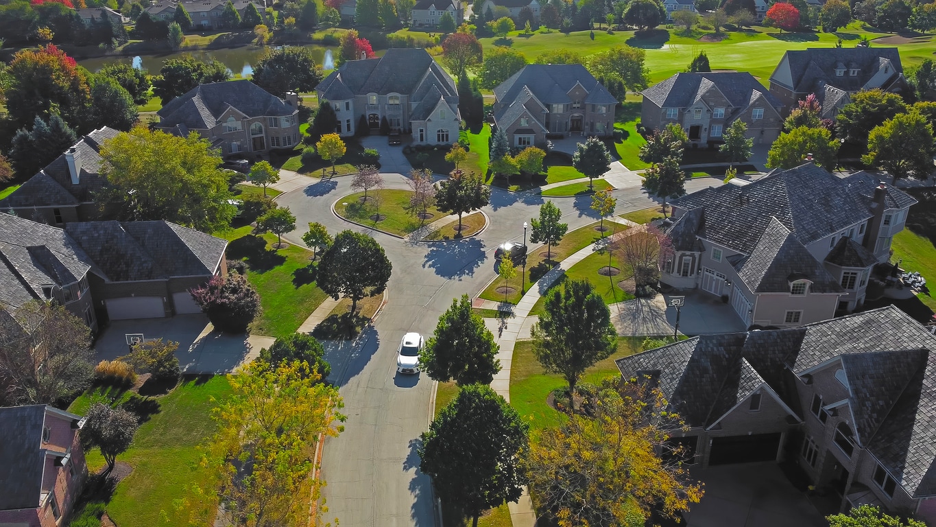 Aerial view of an affluent suburban neighborhood in Illinois with autumn trees