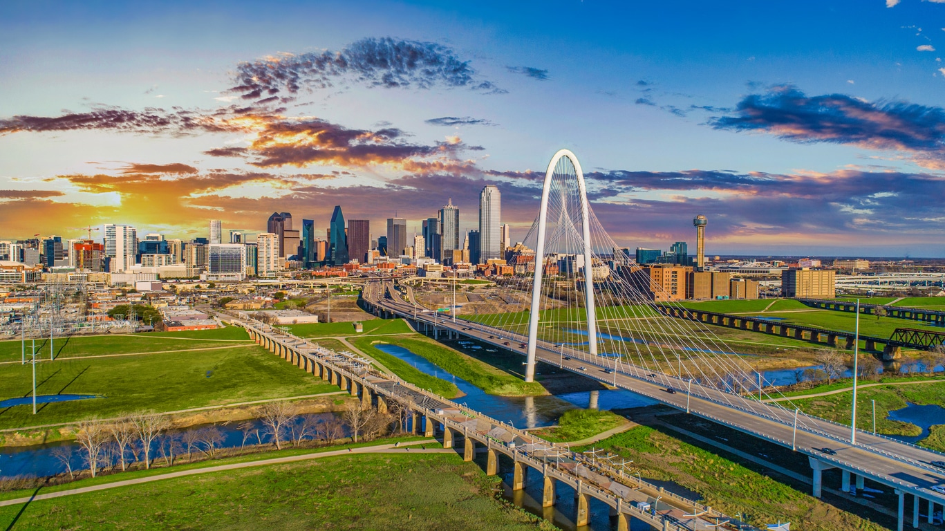 The Dallas skyline featuring the Margaret Hunt Hill Bridge, a welcoming sight for those moving from Denver to Dallas