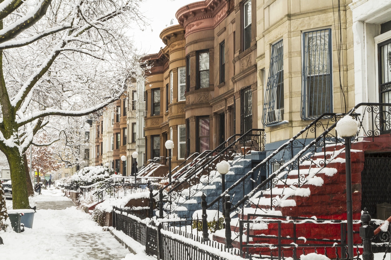 Colorful Stoops in the Snow Snow-covered sidewalk and stoops of colorful New York City brownstones after a winter snowfall
