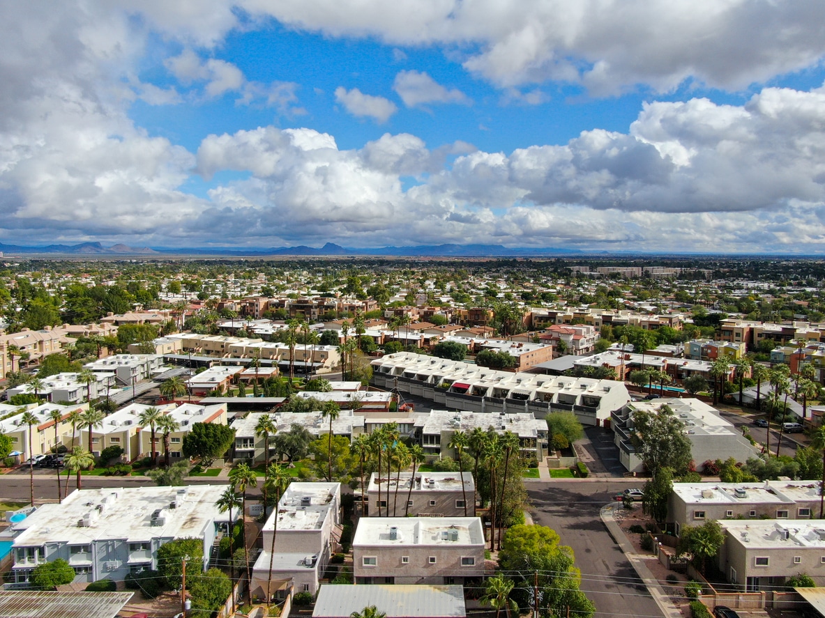  Aerial view of one of the best neighborhoods in Scottsdale with winding streets and green trees